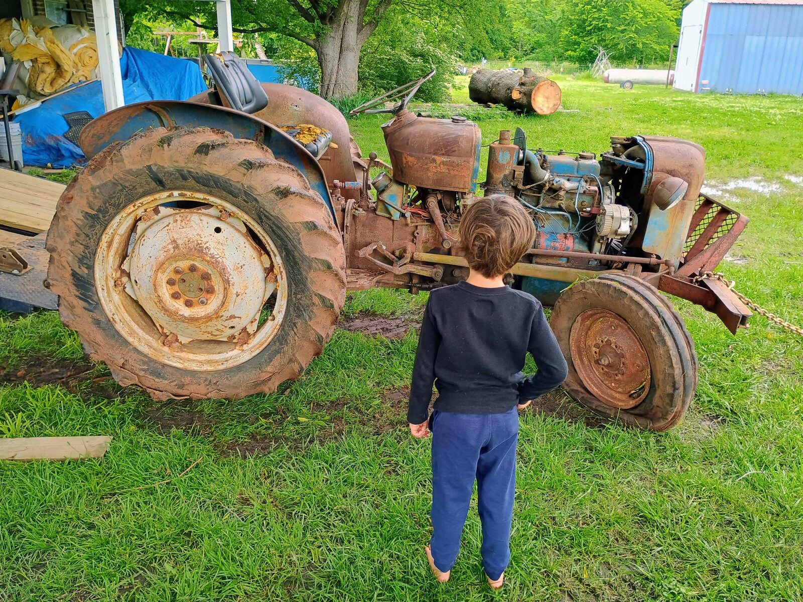 Kid checking out the new tractor