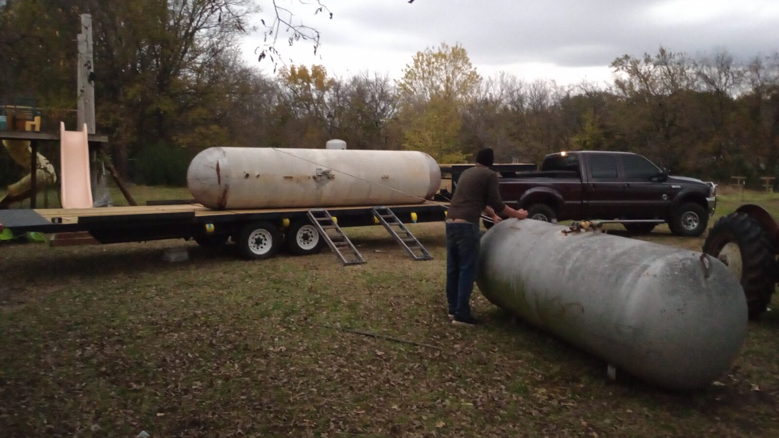 Propane tanks in the yard — raw material for the smoker builds