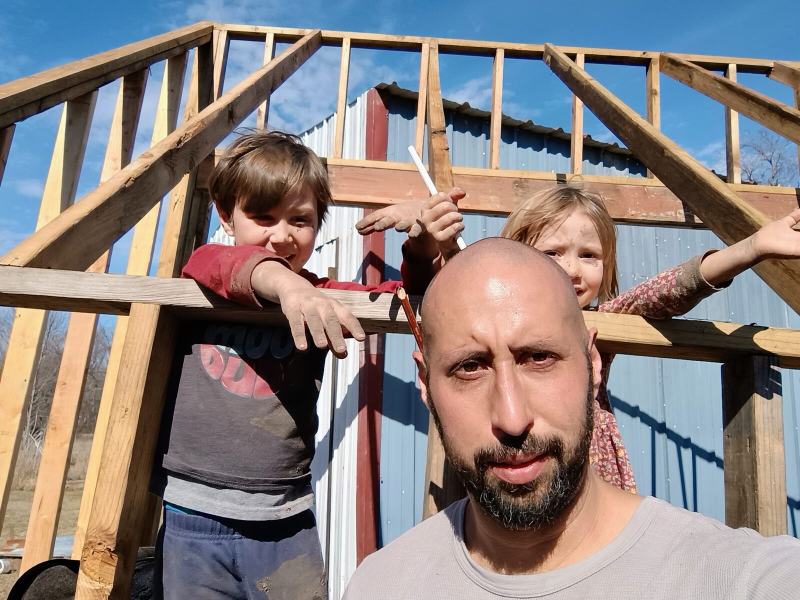 Family selfie in front of the kiln frame