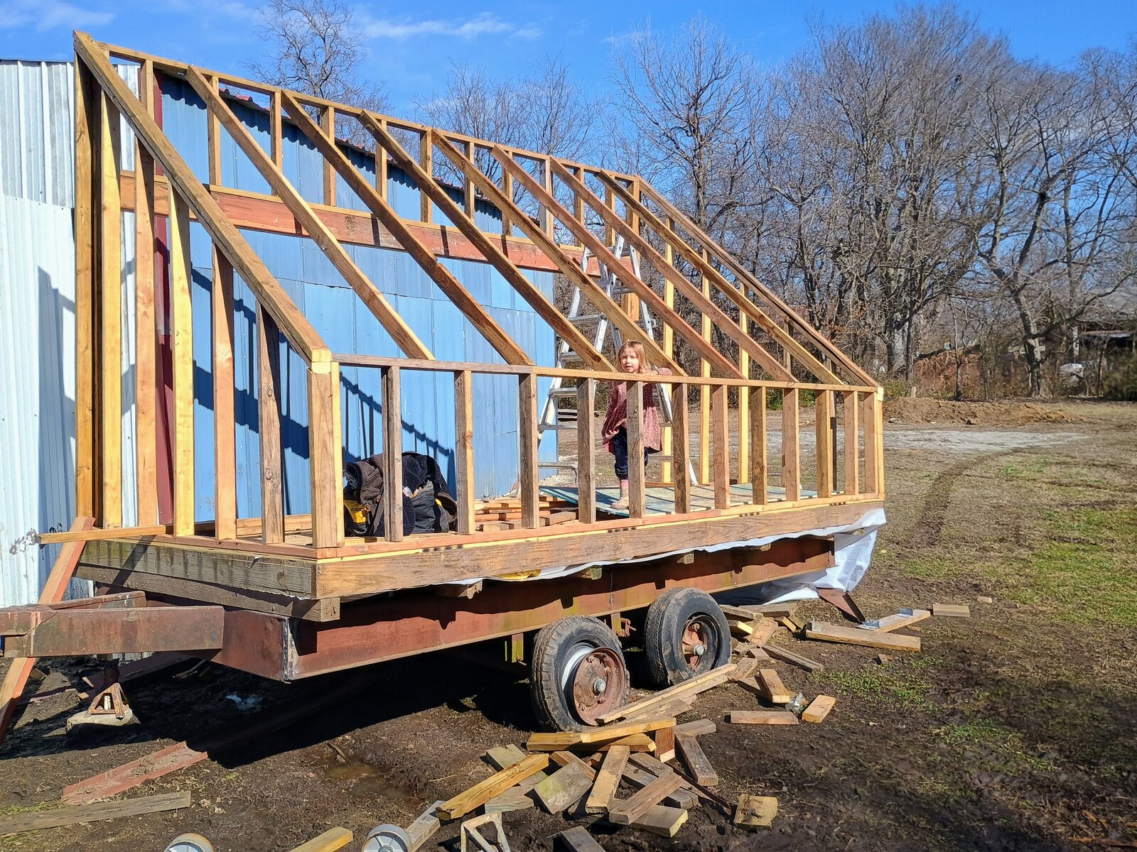 Wider angle showing the full kiln frame on the trailer next to the shop